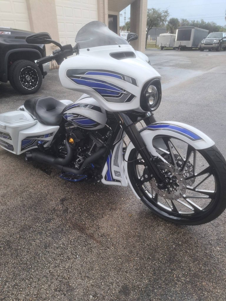 White and blue custom bagger built by Cutting Edge Cycles